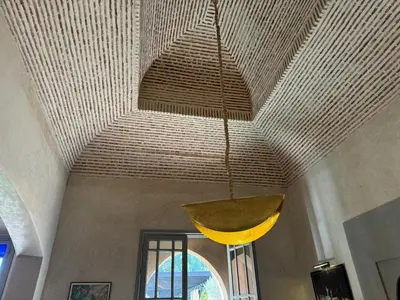 a hanging pendant light hanging from a ceiling at Villa Ania in Marrakech