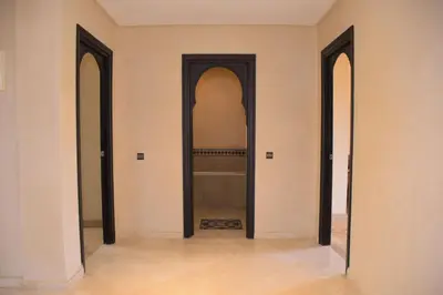 an empty room with two doors and a mirror at Capstay Riad Villa in secure residence in Marrakech