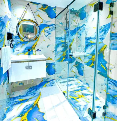 a blue and white bathroom with a shower and a sink at 17 - Top Location, NEUF, piscine & Comfort in Marrakech