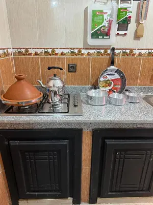 a tea kettle sitting on top of a stove in a kitchen at Familial Cosy Appart in Marrakech