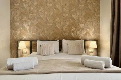 a bedroom with a large bed with two pillows at Apartment in Centre of Marrakech in Marrakech