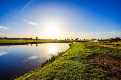 a body of water with the sun in the sky at Serene Stay Cozy Flat in Marrakech in Marrakech