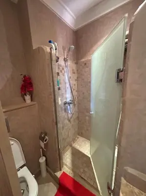 a bathroom with a shower and a toilet at appart jardin de l atlas Marrakech Waky Beach Golf Montagne de l Atlas in Marrakech