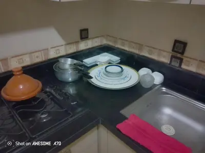 a kitchen counter with a stove and a plate on it at Au cœur de Marrakech in Marrakech