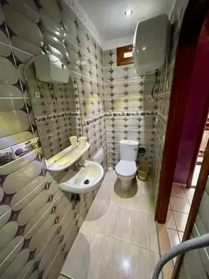 a bathroom with a toilet and a sink at Riad Mido in Marrakech