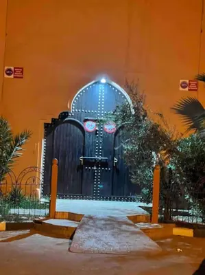 a door to a building with snow on the ground at Riad Mido in Marrakech