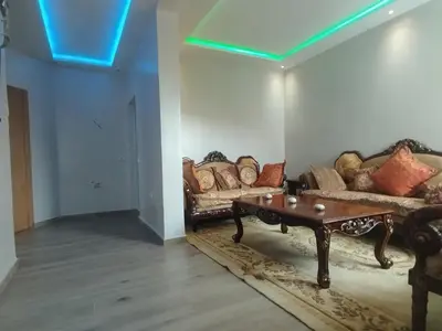 a living room with two couches and a coffee table at Tout est Nouveau et Propre,au Centre marrakech in Marrakech
