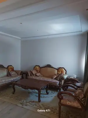 a living room with couches and a coffee table at Tout est Nouveau et Propre,au Centre marrakech in Marrakech