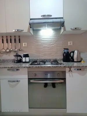 a kitchen with a stove and a counter top at Marrakech Luxury ATLAS in Marrakech