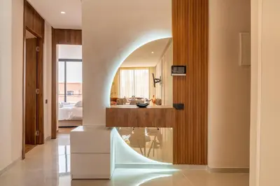 a living room with a hallway with an archway at Luxe Urbain - 3 Chambres en Centre-Ville in Marrakech