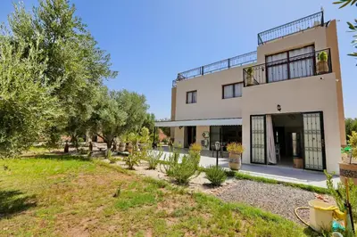 a building with trees in front of it at Villa Sahar in Marrakech