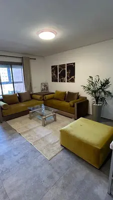 a living room with two couches and a table at Center appartement Marrakech in Marrakech
