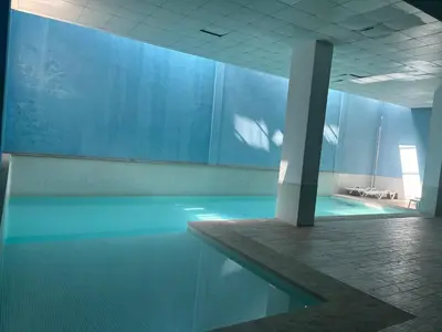 a room with a pool of water in a building at Center appartement Marrakech in Marrakech