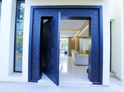 a hallway with a blue wall in a house at VILLA Wa EXCLUSIVE MARRAKECH in Marrakech
