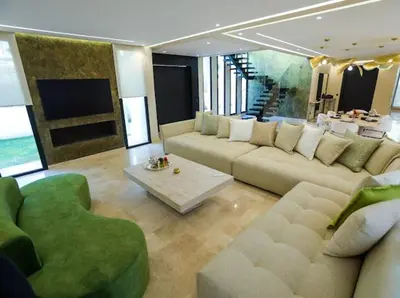 a living room with a couch and a table at VILLA Wa EXCLUSIVE MARRAKECH in Marrakech