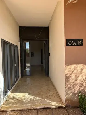 an empty hallway with a sign on the side of a building at Luxury apartment in Marrakech in Marrakech
