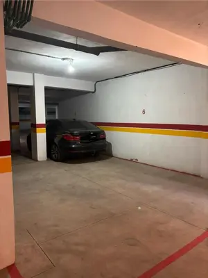 a parking garage with a car parked in it at Luxury apartment in Marrakech in Marrakech
