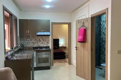a kitchen with a sink and a counter top at Apparemment de haut standing in Marrakech