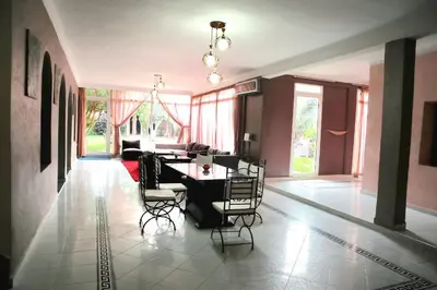 a dining room with a table and chairs at Gîte AYA in Marrakech