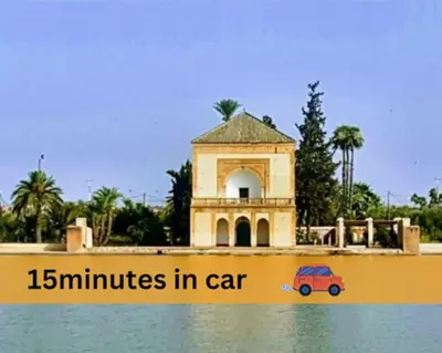 a toy car is sitting in the water in front of a building at NATURALapartmentLARGE pool in Marrakech