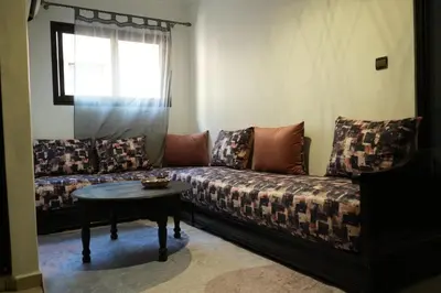 a living room with a couch and a table at Bayt Al Atlas in Marrakech