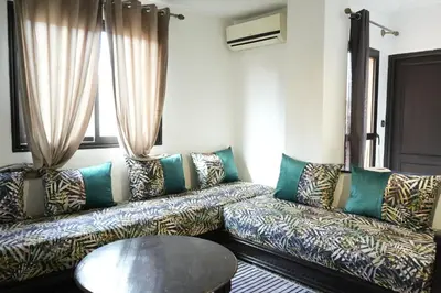 a living room with a couch and a table at Bayt Al Atlas in Marrakech