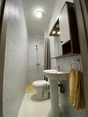 a bathroom with a toilet and a sink at Maison lala in Marrakech