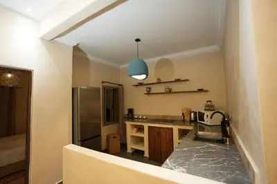 a kitchen with a sink and a refrigerator at Romantic getaway heart of Gueliz in Marrakech