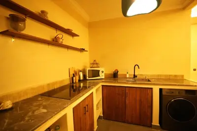 a kitchen with a sink and a microwave at Romantic getaway heart of Gueliz in Marrakech