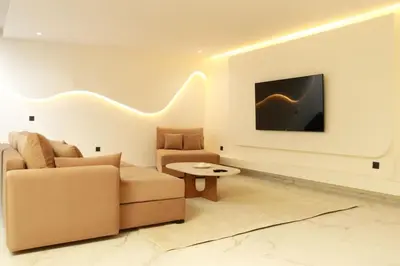 a living room with a couch and a table at Superbe Duplex piscine chauffée in Marrakech