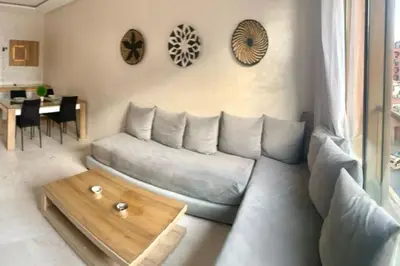 a living room with a couch and a table at 2-Bedroom Apart, Heart of Gueliz in Marrakech