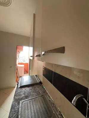 a kitchen with a sink and a faucet at Location Familiale Marrakech 2 in Marrakech