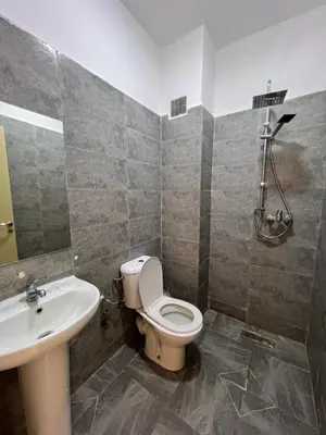 a bathroom with a toilet and a sink at Location Familiale Marrakech 2 in Marrakech