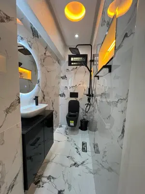 a bathroom with a sink and a mirror at Superbe appartement à Marrakech in Marrakech