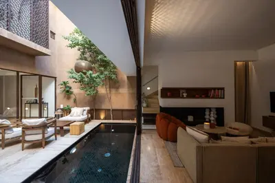 a living room with a pool in the middle at Riad 17 DAR CHAMAR in Marrakech