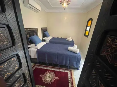 a view of a bedroom with two beds at Riad mostafa in Marrakech