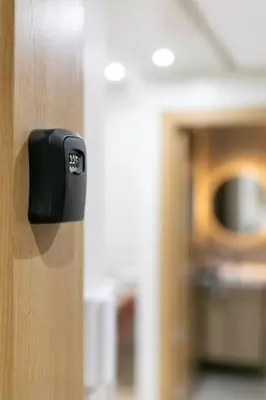 a black door knob on a wooden door at Chic urbain en plein centre in Marrakech