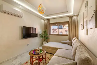 a living room with a couch and a bed at appt élégant et confort dans le centre de Marrakech in Marrakech