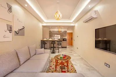 a living room with a couch and a table at appt élégant et confort dans le centre de Marrakech in Marrakech