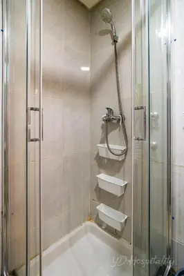 a bathroom with a shower and a sink at 5-Star Atlas Pearl well Centered in Marrakech