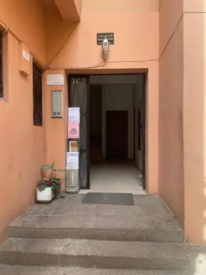 an entrance to a pink building with a door at Cozy Studio center of Marrakech in Marrakech