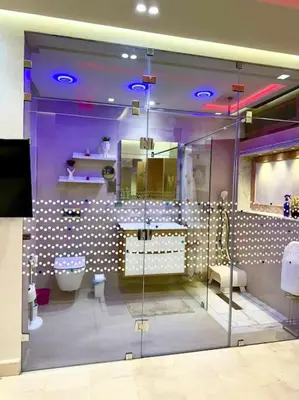 a purple bathroom with a toilet and a sink at Maison du Bonheur à Marrakech in Marrakech