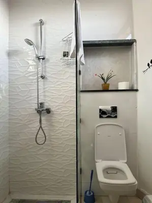 a bathroom with a shower and a toilet at Maison du Bonheur à Marrakech in Marrakech