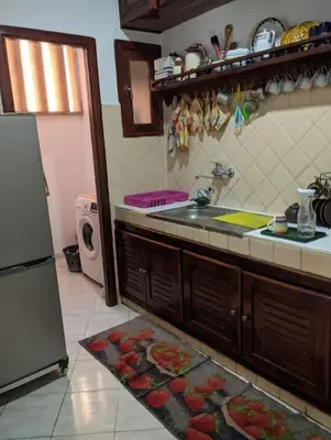 a kitchen with a sink and a refrigerator at Quiet and family apartment, appartement in Marrakech