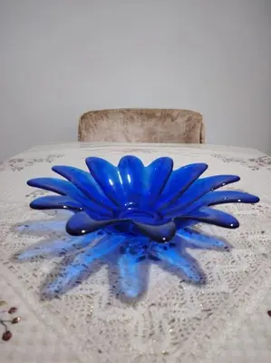 a blue glass flower sitting on top of a table at Quiet and family apartment, appartement in Marrakech