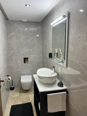 a bathroom with a sink and a toilet at Appartement au cœur de Marrakech in Marrakech