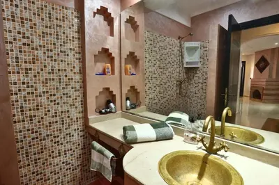 a bathroom with a sink and a large mirror at Amazing view, apartment in Marrakech in Marrakech