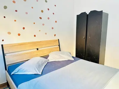 a bedroom with a bed and a wall with hearts on it at Appartement au centre de Gueliz, hivernage in Marrakech