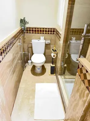 a bathroom with a toilet and a sink at Appart au Cœur de Gueliz in Marrakech
