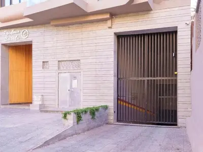 a building with a garage door with a gate at Élégance urbaine, Gueliz central in Marrakech